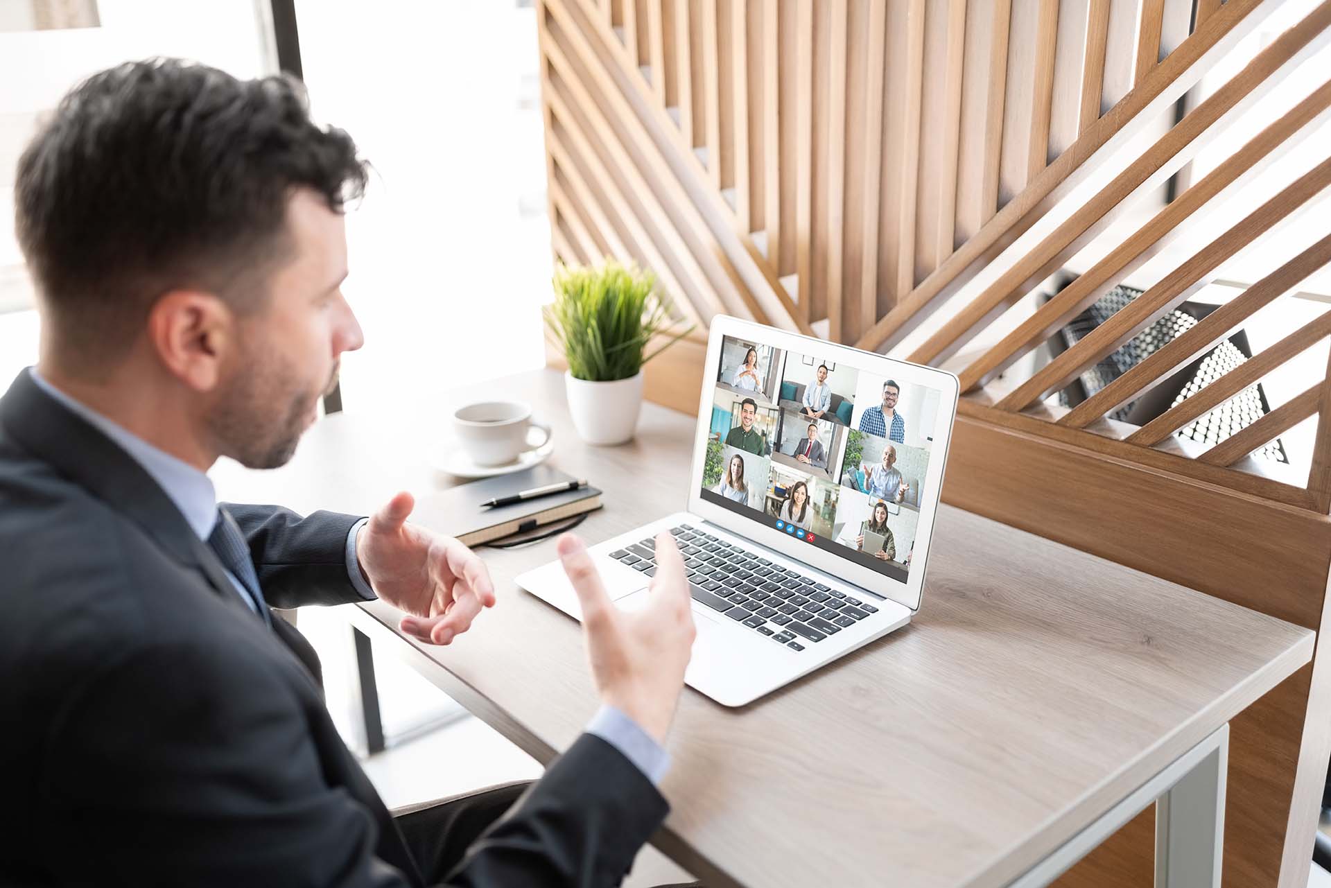 Man making video call with laptop in office